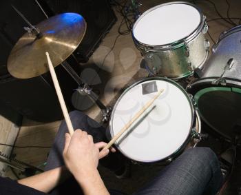 Royalty Free Photo of a Drummer Playing the Drums