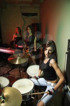 Royalty Free Photo of a Girl Band Playing Instruments