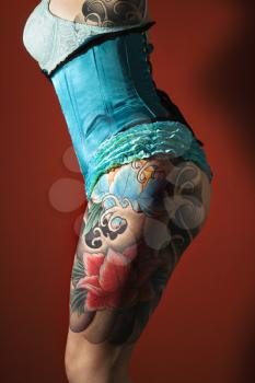 Royalty Free Photo of a Woman's Tattooed Leg