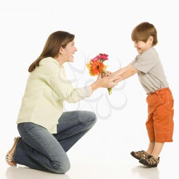 Royalty Free Photo of a Son Giving a Bouquet of Flowers to His Mother