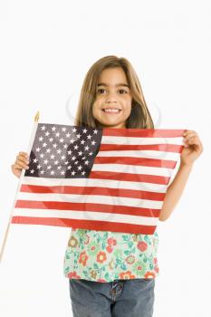 Royalty Free Photo of a Girl Holding an American Flag and Smiling