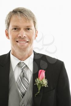 Royalty Free Photo of a Man in a Tuxedo with a Boutonniere