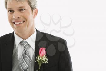 Royalty Free Photo of a Man in a Tuxedo Wearing a Boutonniere