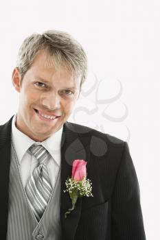Royalty Free Photo of a Groom Wearing a Boutonniere 