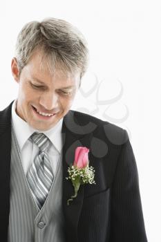 Royalty Free Photo of a Man in a Tuxedo with a Boutonniere