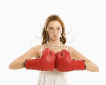Royalty Free Photo of a Bride Wearing Boxing Gloves