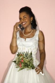 Royalty Free Photo of an African American Bride Talking on a Cellphone 