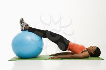 Royalty Free Photo of a Woman Working Out With an Exercise Ball