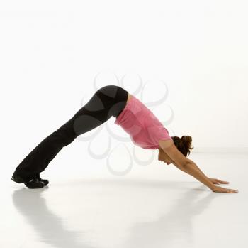 Royalty Free Photo of a Woman Wearing Exercise Clothing in the Downward Dog Yoga Pose