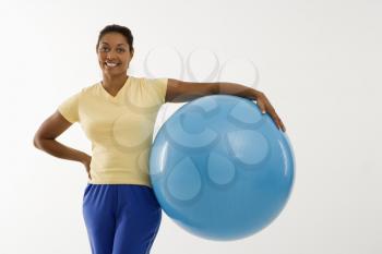 Royalty Free Photo of a Woman Holding an Exercise Ball