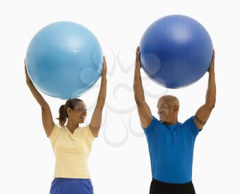 Royalty Free Photo of a Man and a Woman Exercising Together