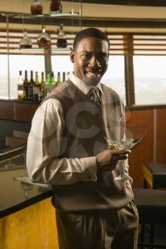 Royalty Free Photo of a Smiling Man Holding a Martini