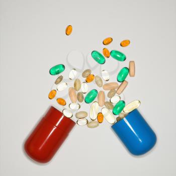 Royalty Free Photo of a Container of Spilled Pills