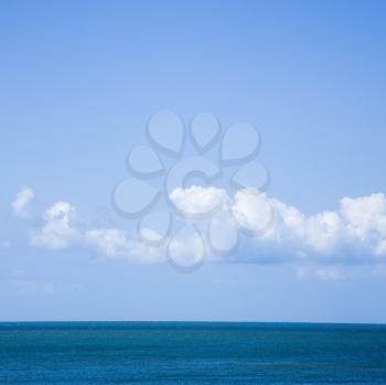 Royalty Free Photo of an Ocean and Sky With Low Cumulus Clouds