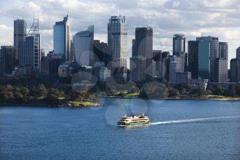 Royalty Free Photo of an Aerial View Ferryboat Crossing a Harbour With Skyline of  Sydney, Australia
