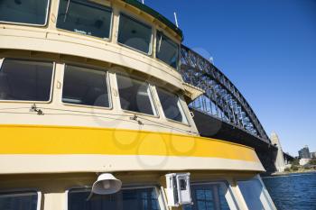 Royalty Free Photo of a Ferryboat in Sydney Harbour Beside Sydney Harboiur Bridge, Australia
