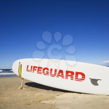 Royalty Free Photo of a Lifeguard Surfboard on a Beach in Surfers Paradise, Australia