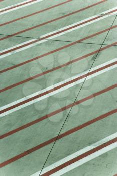 Red and white lines on runway concrete at Melbourne Airport, Australia