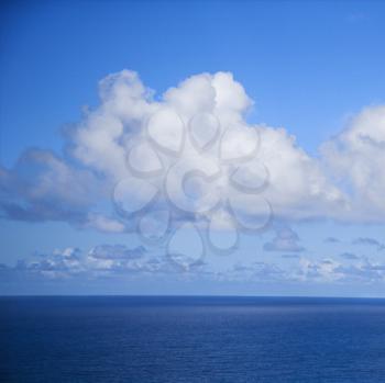 Royalty Free Photo of the Pacific Ocean and Blue Sky With Puffy Clouds