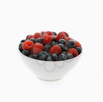 Royalty Free Photo of a Bowl of Mixed Blueberries and Raspberries