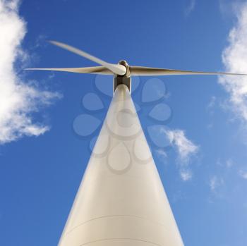 Royalty Free Photo of a Wind Turbine Against a Blue Sky