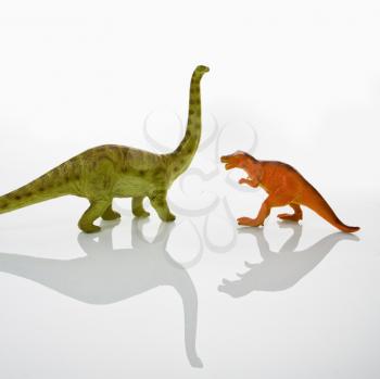 Royalty Free Photo of Plastic Toy Tyrannosaurus and Apatosaurus Dinosaurs