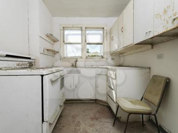 Royalty Free Photo of a Forgotten Empty Abandoned Dirty Kitchen