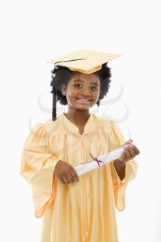 African American girl in graduation robe and hat holding diploma and smiling at viewer.