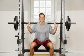Royalty Free Photo of a Man Lifting Weights in a Gym