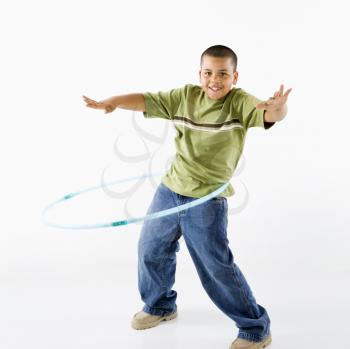 Royalty Free Photo of a Boy Using a Hula Hoop