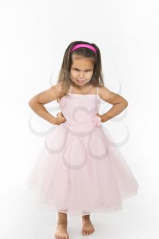 Royalty Free Photo of a Little Girl Wearing a Pink Dress Pouting