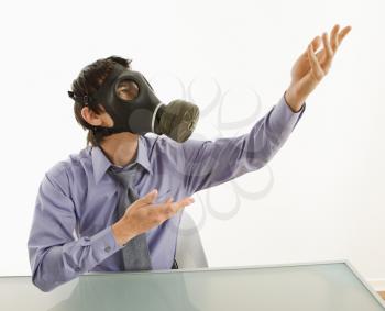 Royalty Free Photo of a Businessman Wearing a Gas Mask