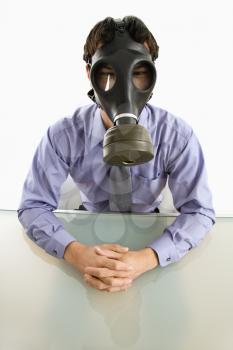 Royalty Free Photo of a Businessman Wearing a Gas Mask 