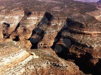 Aerial view of an arid, craggy landscape. Horizontal shot.