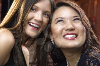 Portrait of two pretty smiling young women.