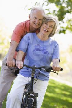 Royalty Free Photo of a Senor Couple on a Bike