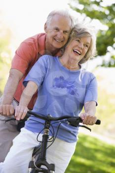 Royalty Free Photo of a Senior Couple on a Bike