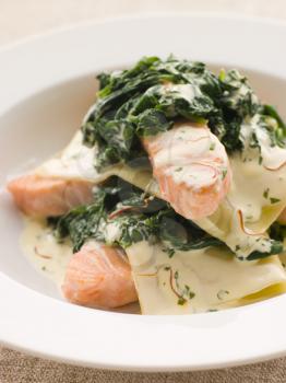 Royalty Free Photo of Lasagna Noodles, Salmon and Spinach In a Saffron Cream