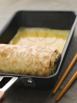 Royalty Free Photo of Rolled Dashi Omelet in a Square Frying Pan