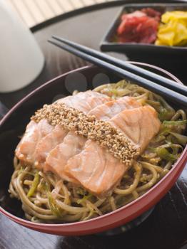 Royalty Free Photo of Sesame Crusted Salmon Fried Noodles and Pickles