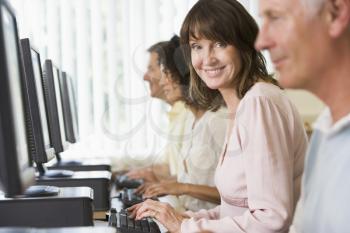 Royalty Free Photo of Four People At Computer Terminals