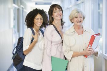 Royalty Free Photo of Women of Three Age Groups Standing in a School Hall