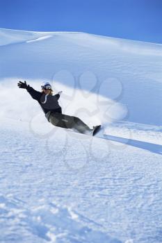 Royalty Free Photo of a Person Snowboarding