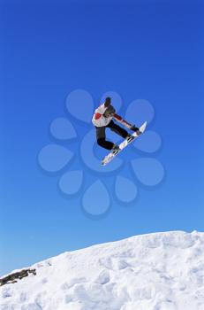 Royalty Free Photo of a Snowboarder in the Air