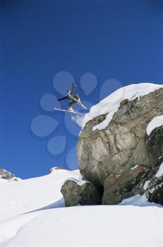 Royalty Free Photo of a Skier Coming Off a Hill