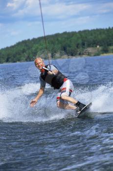 Royalty Free Photo of a Man Water Skiing