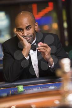 Royalty Free Photo of a Man at a Roulette Table