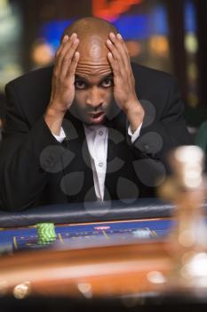 Royalty Free Photo of a Man Losing at Roulette