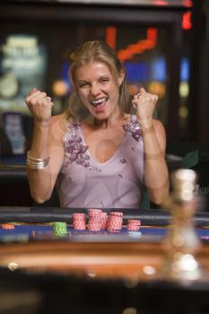 Royalty Free Photo of a Woman Winning at Roulette