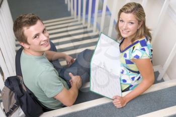 Royalty Free Photo of Two Students Sitting on Steps
